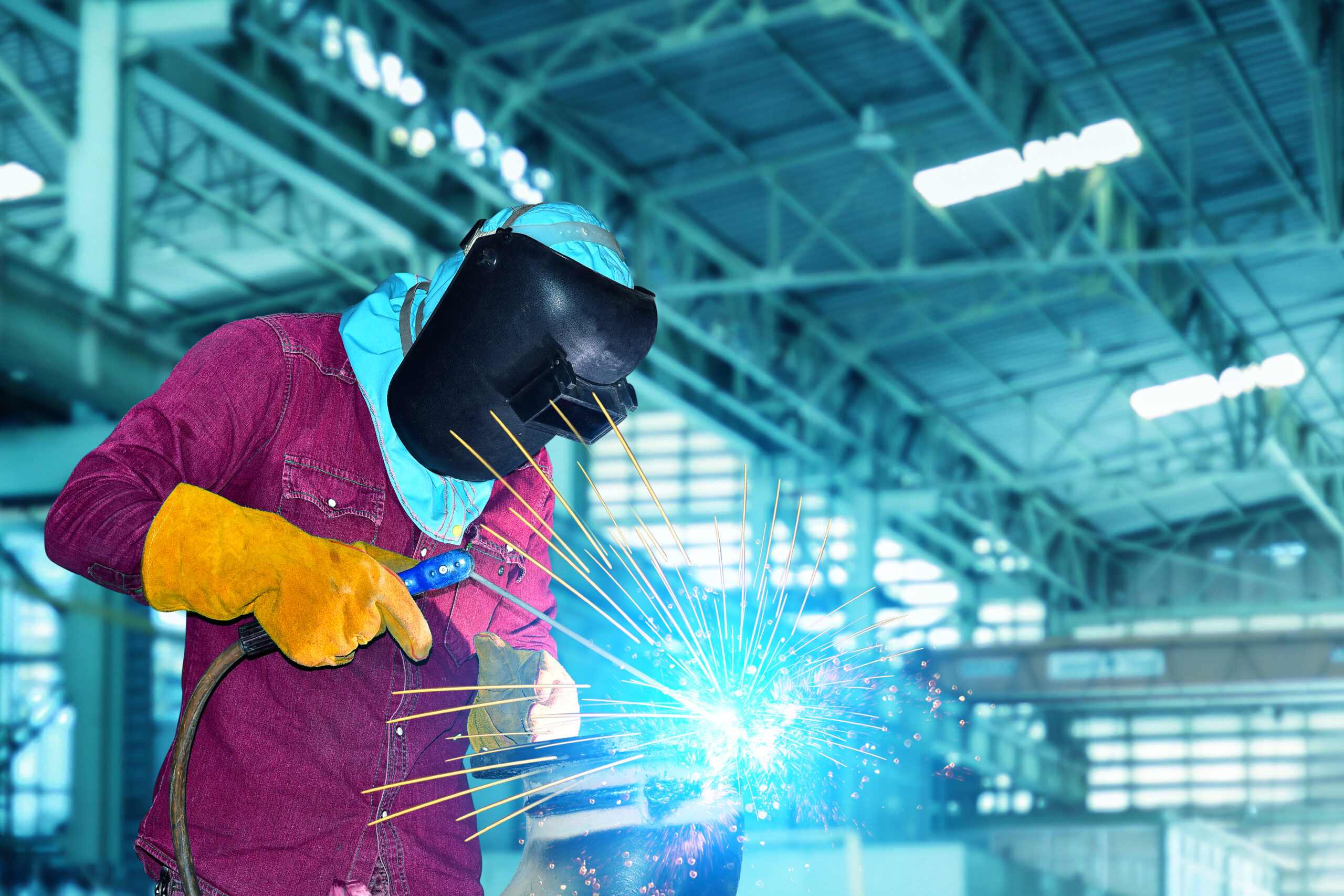 Welder,In,Industrial,Worker,With,Welding,Tool,With,Sparks,Light